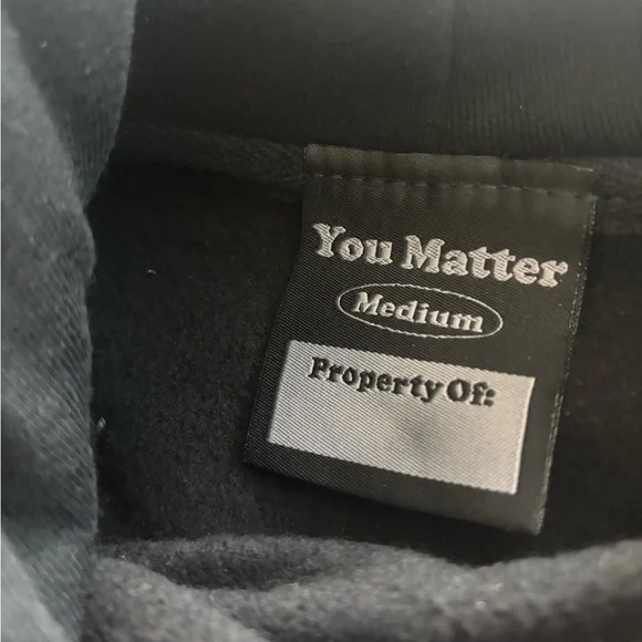 You Matter Black on Black Emrodiered Hoodie - Size Medium.